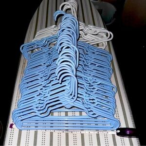 53 childrens hangers, 12", 41 blue, 12 white, like new, all same size and design